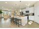 Open-concept kitchen with sleek white cabinets, stainless appliances, and large center island at 6139 Wayburn St, Tucker, GA 30084