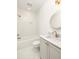 Bright bathroom featuring a tub with herringbone tile surround and white hexagon tile flooring at 10904 Serenbe Ln, Chattahoochee Hills, GA 30268