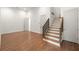 Open-concept living space with hardwood floors, staircase, and ample natural light at 10904 Serenbe Ln, Chattahoochee Hills, GA 30268