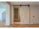 Sliding barn door separating the bedroom and the bathroom at 22 Waters Bridge Cir, Covington, GA 30014
