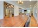 Open concept view of the dining room, kitchen, and living room with hardwood flooring at 22 Waters Bridge Cir, Covington, GA 30014