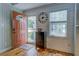 Inviting entryway with beautiful wood floors, shiplap walls, and a stylish door that sets a welcoming tone at 22 Waters Bridge Cir, Covington, GA 30014