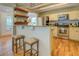 Charming kitchen featuring stainless steel appliances, granite countertops, and a breakfast bar with seating at 22 Waters Bridge Cir, Covington, GA 30014