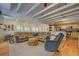 Spacious living room and kitchen featuring an open layout, hardwood floors, and lots of natural light at 22 Waters Bridge Cir, Covington, GA 30014