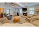 Inviting living room featuring a fireplace, beamed ceilings, hardwood floors, and cozy furniture for relaxation at 22 Waters Bridge Cir, Covington, GA 30014