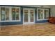 Covered outdoor patio featuring durable flooring, french doors, and peaceful views of the outdoors at 22 Waters Bridge Cir, Covington, GA 30014