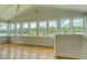 Bright sunroom with panoramic views of the lake and surrounding greenery from many windows at 22 Waters Bridge Cir, Covington, GA 30014