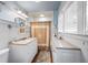 Bathroom featuring white cabinets, granite countertops, and beadboard walls at 255 Maple Nw Ave, Marietta, GA 30064