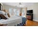 Bedroom features hardwood floors, shutters, and french doors to outdoor area at 255 Maple Nw Ave, Marietta, GA 30064