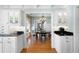 Dining room with overhead chandelier and white cabinets with glass doors for storage at 255 Maple Nw Ave, Marietta, GA 30064