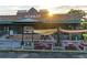 Marietta Square Market with outdoor dining featuring red picnic tables and a covered awning at 255 Maple Nw Ave, Marietta, GA 30064