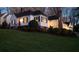 Charming home at dusk with a well-manicured lawn and bright front door at 255 Maple Nw Ave, Marietta, GA 30064