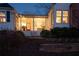 Well-lit exterior showing a covered porch, charming details and lush landscaping at 255 Maple Nw Ave, Marietta, GA 30064