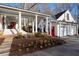 Back exterior featuring a large porch, outdoor kitchen and a three car garage at 255 Maple Nw Ave, Marietta, GA 30064