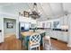 Bright kitchen with stainless steel appliances, white cabinets, and a green island with seating at 255 Maple Nw Ave, Marietta, GA 30064