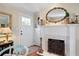 Living room showcasing a fireplace with decorative mirror and elegant decor at 255 Maple Nw Ave, Marietta, GA 30064