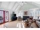 Light-filled living area with vaulted ceilings, fireplace, and cozy seating arrangement at 255 Maple Nw Ave, Marietta, GA 30064