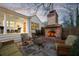 Beautiful outdoor patio area with brick fireplace, stone paving and comfortable seating at 255 Maple Nw Ave, Marietta, GA 30064