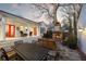 Well-designed outdoor living space with brick fireplace, seating and a covered patio at 255 Maple Nw Ave, Marietta, GA 30064