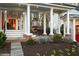 Inviting covered outdoor patio area with fireplace and beautiful landscaping at 255 Maple Nw Ave, Marietta, GA 30064