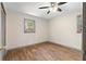 Comfortable bedroom with attractive ceiling fan and wood-look flooring at 3152 Ridgecrest Dr, Powder Springs, GA 30127