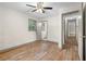 Bright bedroom featuring wood-look flooring, ceiling fan, and attached bathroom at 3152 Ridgecrest Dr, Powder Springs, GA 30127