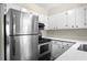 Well-lit kitchen featuring stainless steel appliances and bright countertops at 3152 Ridgecrest Dr, Powder Springs, GA 30127