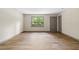 Bright living room with new flooring, a large window, and fresh paint, creating a welcoming and airy atmosphere at 3152 Ridgecrest Dr, Powder Springs, GA 30127