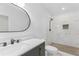 Modern bathroom with a marble-tiled shower, sleek vanity and sink at 331 Highway 162, Covington, GA 30016