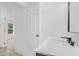 Modern bathroom features white countertop, sleek black faucet, and access to a bright room at 331 Highway 162, Covington, GA 30016