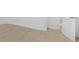 Bright bedroom featuring light wood flooring and a white door at 331 Highway 162, Covington, GA 30016