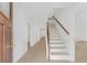 Inviting entryway with a modern staircase and wood-look flooring, offering a bright and open feel at 331 Highway 162, Covington, GA 30016