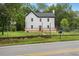 Charming two-story home with a dark roof and newly installed light-colored wood deck at 331 Highway 162, Covington, GA 30016