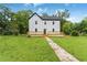 Charming two-story home with a dark roof and newly installed light-colored wood deck at 331 Highway 162, Covington, GA 30016