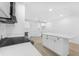 Bright, spacious kitchen features white cabinets, stainless steel appliances, and a center island at 331 Highway 162, Covington, GA 30016