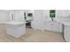 Newly renovated kitchen features an island, sleek appliances and modern cabinetry at 331 Highway 162, Covington, GA 30016