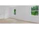 Living room with neutral paint, wood-look flooring, and natural light at 331 Highway 162, Covington, GA 30016