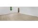 Bright living room featuring neutral paint, wood-look flooring, and natural light at 331 Highway 162, Covington, GA 30016