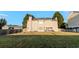 Large backyard with a lush lawn, a wood fence, and a patio area at 335 Wilma Sw Ct, Atlanta, GA 30331