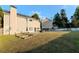 Spacious backyard featuring a well-maintained lawn, a patio, and garden beds at 335 Wilma Sw Ct, Atlanta, GA 30331