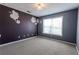 Simple bedroom with a large window and carpeted floors at 335 Wilma Sw Ct, Atlanta, GA 30331
