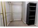 Spacious closet featuring metal hanging rods and built in black shelving at 335 Wilma Sw Ct, Atlanta, GA 30331