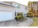 Charming two-story home with a well-manicured front yard and attached garage provides comfortable living at 335 Wilma Sw Ct, Atlanta, GA 30331