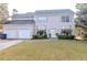Charming two-story home with a well-manicured front yard and attached garage provides comfortable living at 335 Wilma Sw Ct, Atlanta, GA 30331
