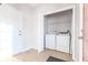 Laundry room featuring side-by-side white washer and dryer units and tile flooring at 335 Wilma Sw Ct, Atlanta, GA 30331