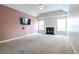 Spacious living room with a fireplace, neutral carpet, and vaulted ceilings at 335 Wilma Sw Ct, Atlanta, GA 30331