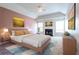 Staged bedroom with a bed, vaulted ceiling, and natural light at 335 Wilma Sw Ct, Atlanta, GA 30331