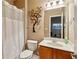 Bathroom featuring a toilet, shower with curtain, a tree wall decor, and vanity with sink at 3895 Old Atlanta Station Se Dr # 1, Atlanta, GA 30339
