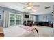 Bedroom features ceiling fan, and a workspace overlooking a lush, green backyard at 3895 Old Atlanta Station Se Dr # 1, Atlanta, GA 30339