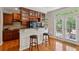 Modern kitchen with cherry cabinets, granite counters and stainless appliances at 3895 Old Atlanta Station Se Dr # 1, Atlanta, GA 30339